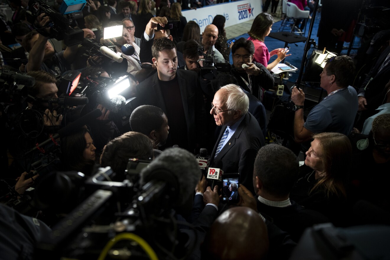 Democratic presidential candidate Sen. Bernie Sanders of Vermont is surrounded by media following a debate in Charleston, S.C., on Tuesday. Feb. 25. 